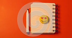 Isometric open blank spiral notebook and white pen isolated on red background. Mock up for corporate identity and promotion