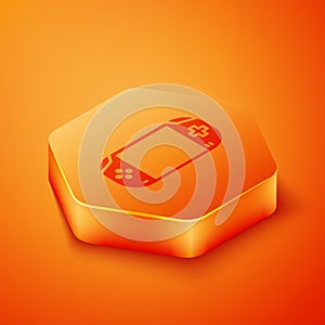 Isometric Portable video game console icon isolated on orange background. Gamepad sign. Gaming concept. Orange hexagon