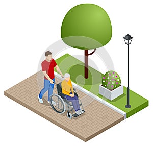 Isometric son walking with disabled father in wheelchair at park. Assistance, rehabilitation and health care.