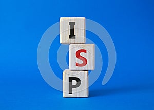 ISP - Internet Service Provider symbol. Concept word ISP on wooden cubes. Beautiful blue background. Business and ISP concept.