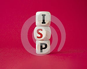 ISP - Internet Service Provider symbol. Concept word ISP on wooden cubes. Beautiful red background. Business and ISP concept. Copy