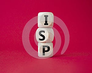 ISP - Internet Service Provider symbol. Concept word ISP on wooden cubes. Beautiful red background. Business and ISP concept. Copy