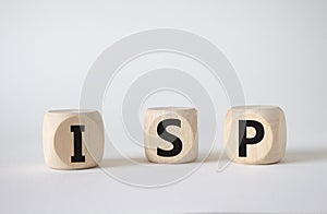 ISP - Internet Service Provider symbol. Concept word ISP on wooden cubes. Beautiful white background. Business and ISP concept.