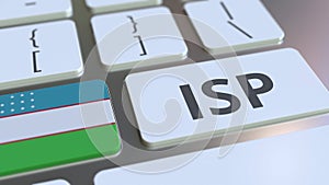 ISP or Internet Service Provider text and flag of Uzbekistan on the computer keyboard. National web access service