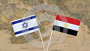 Israel and Egypt flag pins on a world map, political or diplomatic relations concept