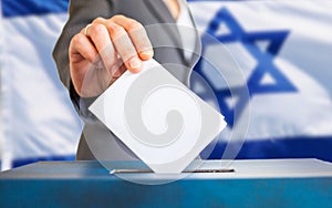 israel elections hand putting vote in ballot