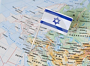 Israel flag pin on map photo