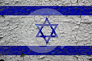 Israel flags painted over cracked concrete wall