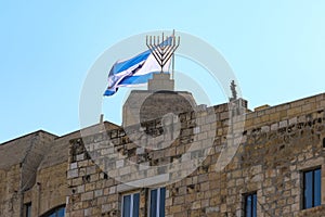 Israel Jerusalem, The Israeli flag and the nine-armed candlestick photographed from the ground floor near the wailing wall.