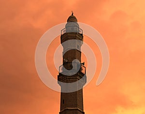 Israel, Tel Aviv. Mosque minaret on beautiful sunset time