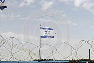 Israeli flag and barbed wires