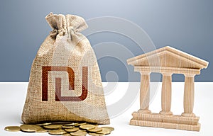 Israeli shekel money bag and bank / government building. Budgeting, national financial system. Support businesses in crisis.