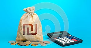 Israeli shekel money bag and calculator. Accounting concept. Analysis of loan selection. Income and expenses. Calculation