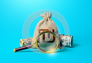 Israeli shekel money bag and magnifying glass. Anti money laundering, tax evasion. Deposit or loan terms and conditions. Find