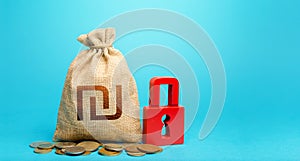 Israeli shekel money bag and red padlock. Tight government control over the financial system. Blocking bank accounts and seizing