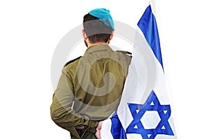 Israeli soldier with Flag of Israel behind his back photo