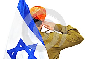 Israeli soldier with Israel flag salutes in an orange beret. White isolated background photo