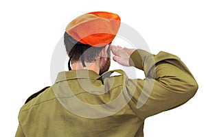 Israeli soldier salutes in an orange beret. White isolated background photo
