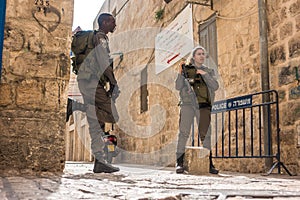 Israeli soldiers - man and woman - guarding Jerusalem