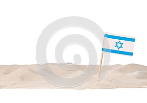Israeli toothpick paper flag on white sand