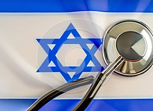 Israelite Sanitation. Medical stethoscope on an Israeli flag. Israelite medical insurance concept