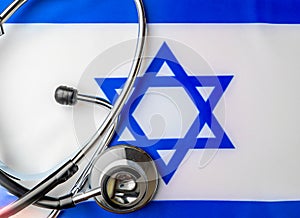 Israelite Sanitation. Medical stethoscope on an Israeli flag. Israelite medical insurance concept