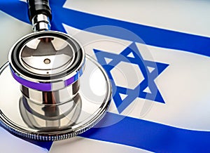 Israelite Sanitation. Medical stethoscope on an Israeli flag. Israelite medical insurance concept