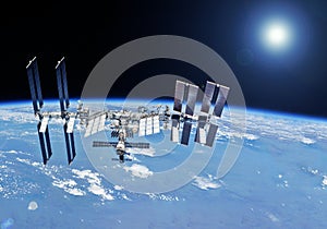 ISS over the planet, against the background of clouds. Elements of this image furnished by NASA