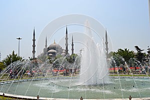 Istanbul Blue Mosque (Sultan Ahmed Mosque) and fountain view from the Sultanahmet Park in Turkey