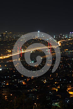 Istanbul city lights and bosphorus bridge photo