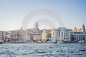 Istanbul city skyline in Turkey, Beyoglu district old houses with Galata tower on top, view from the Golden Horn