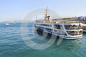 Istanbul Ferries, Eminonu waiting in the harbor photo