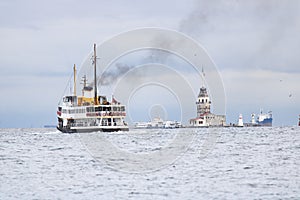 In Istanbul, ferries operate on the Bosphorus line. Traditional old steamers. Cloud weather in the background and the Anatolian photo