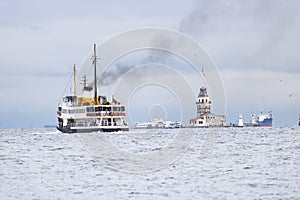 In Istanbul, ferries operate on the Bosphorus line. Traditional old steamers. Cloud weather in the background and the Anatolian photo