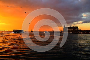 Istanbul haydarpasa railway station and view of ferry at sunset photo