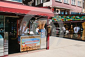 Istanbul, June 15, 2017: Authentic scene. A street ice cream seller in national clothes. Street Cafe.