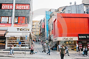 Istanbul, June 14, 2017: A crowd of people walk down the street on the background of building with lot of shops and cafe