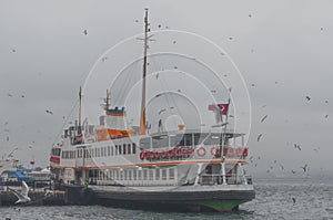 Istanbul, Kadikoy. Foggy morning, waiting to ferry passengers an