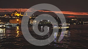 Istanbul night cityscape with looking over Golden Horn to Suleymaniye Mosque on a twilight dramatic sky. 4K UHD video