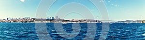 Istanbul sea panorama, business district and Ortakoy Mosque on the background