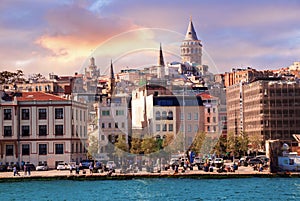 ISTANBUL, TURKEY - 09 07 2020: Karakoy district, Galata Tower with magnificent sunset clouds seen across Golden Horn in