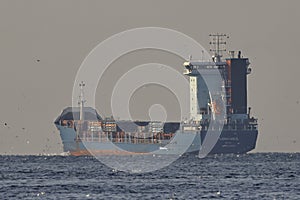 18-11-2025 Istanbul Turkey: Cargo ship LIDER HALIL sailing through the Bosphorus Strait with a load of containers