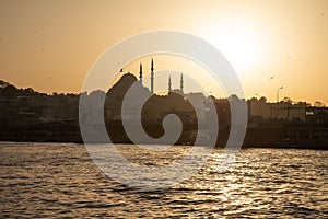 Istanbul, Turkey. The Golden Horn at sunset. Suleymaniye mosque silhouette.