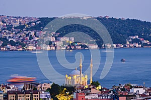 Istanbul, Turkey, July 12, 2021. Ortakoy wharf, ships on the Bosporus. Night city view, Ortakoy Mosque, Bosphorus, and