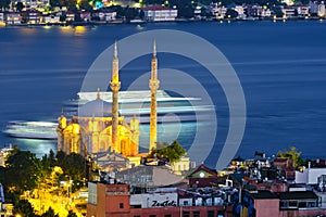 Istanbul, Turkey, July 12, 2021. Ortakoy wharf, ships on the Bosporus. Night city view, Ortakoy Mosque, Bosphorus, and