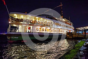 ISTANBUL, TURKEY - JULY 05, 2018: Night view of the old historic cruise vessel Ahmet Hulusi Yildirim (built in 1974)