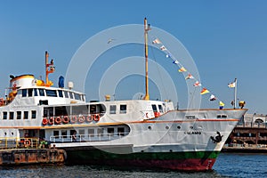 ISTANBUL, TURKEY - JULY 05, 2018: Small cruise ship Kalamis moored in Eminonu pier in Golden Horn bay of the Istanbul