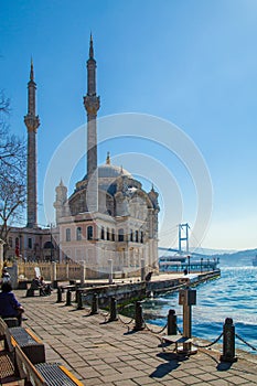 Istanbul, Turkey - March 26, 2019: View of Ortakoy mosque and Bosphorus bridge in Besiktas. Located at the waterside of