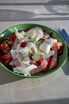 Itaian vegetarian food, fresh caprese salad made with white soft italian mozzarella cheese, red tomato and green basil