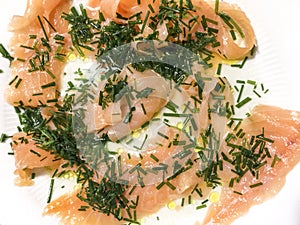 Italian smoked salomon with erba cipollina and oil scallion photo